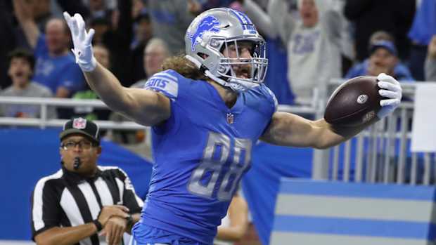 Detroit Lions tight end T.J. Hockenson scores a touchdown against the Seattle Seahawks during the first half at Ford Field, Oct. 2, 2022.